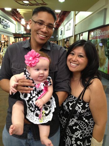 Christopher and Glenda Raon hold their infant Madalynn at a shopping mall in Las Vegas. The couple will officially adopt Madalynn Aug. 12. The Raon’s tried for 12 years to have a baby before the opportunity to adopt presented itself. (Courtesy photo) 
