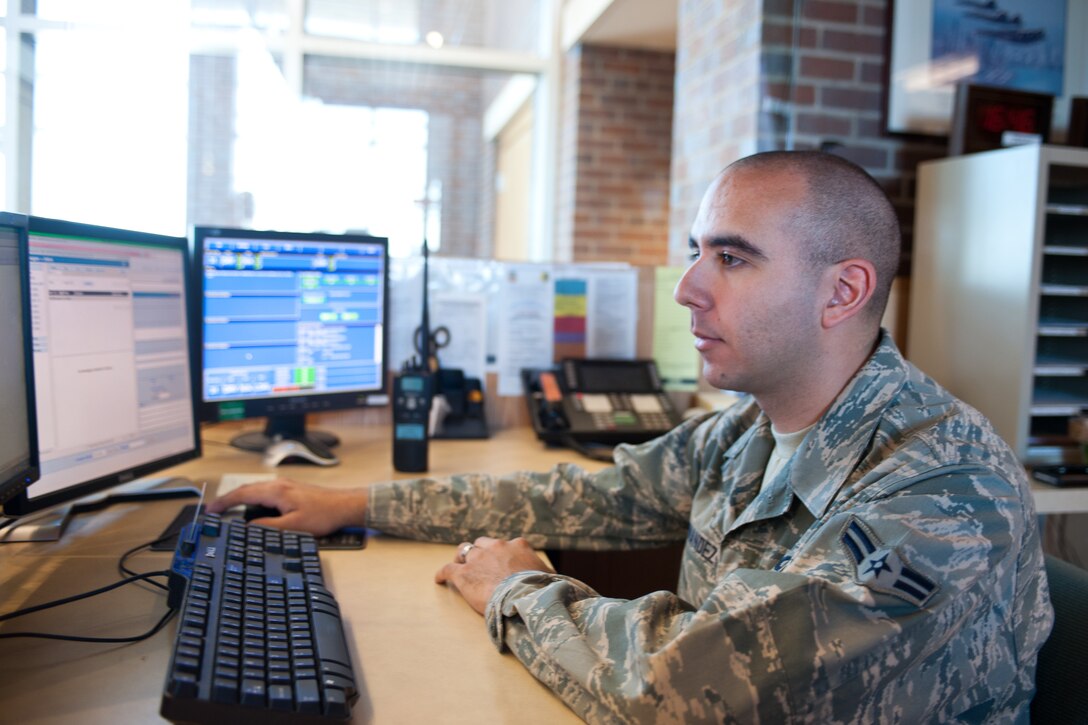 Airman 1st Class Steven Hernandez, 28th Operations Support Squadron Airfield Management operations coordinator, inputs information into an Air Force Form 3616, Daily Log, at Ellsworth Air Force Base, S.D., July 18, 2013. The daily events log provides detailed information between shifts to create continuity, increase efficiency and ensure shift changeovers are smooth. (U.S. Air Force photo by Airman 1st Class Alystria Maurer/Released)