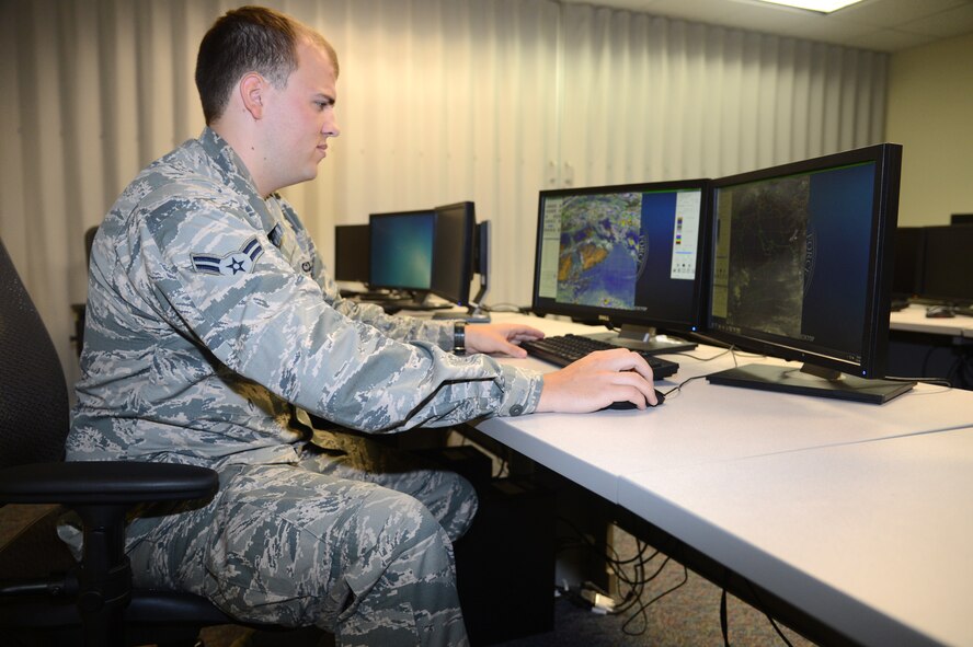Airman 1st Class Luke Ledonne, a weather forecaster with the 28th Operational Weather Squadron, studies global satellite images and tracks weather at the 28th OWS 18 July 13. The 28th OWS tracks and produces weather forecasts for U.S. Air Forces Central Command’s Area of Responsibility. (U.S. Air Force photo by Airman 1st Class Jonathan Bass/Released)
