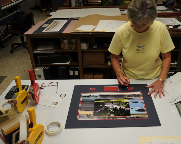 Bobbie Romano, 2nd Force Support Squadron frame shop, measures the mat of a frame on Barksdale Air Force Base, La., July 23, 2013. The frame shop is located inside the Arts and Crafts building and is open Monday through Friday from 9 a.m. to 5 p.m. (U.S. Air Force photo/Senior Airman Sean Martin)