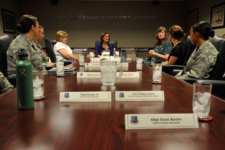 PETERSON AIR FORCE BASE, Colo. –Betty Welsh (center), spouse of Chief of Staff of the Air Force Gen. Mark A. Welsh III, meets with members of the 21st Sexual Assault Prevention and Response office during her visit here July 18. The group discussed successes and challenges of the SAPR program as well as suggestions for improvements Air Force-wide. The 21st SAPR office is a two-time Air Force SAPR office of the year and is led by Jeanine Arnold, 21st Sexual Assault Response Coordinator. For more information about the office, call 554-7272. (U.S. Air Force photo/Robb Lingley)
