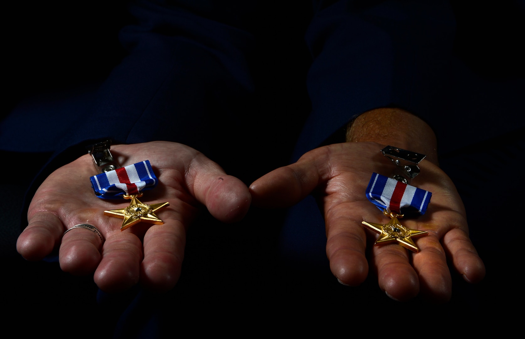 Tech. Sgt. Ismael Villegas, 24th Special Operations Wing combat control recruit liaison and Staff Sgt. Dale Young, 342nd Training Squadron combat control instructor, hold their Silver Stars after on July 22, 2013. Sergeants Villegas and Young were awarded the Silver Star for their actions against enemy forces in Afghanistan. (U.S. Air Force photo by Staff Sgt. Vernon Young Jr.)