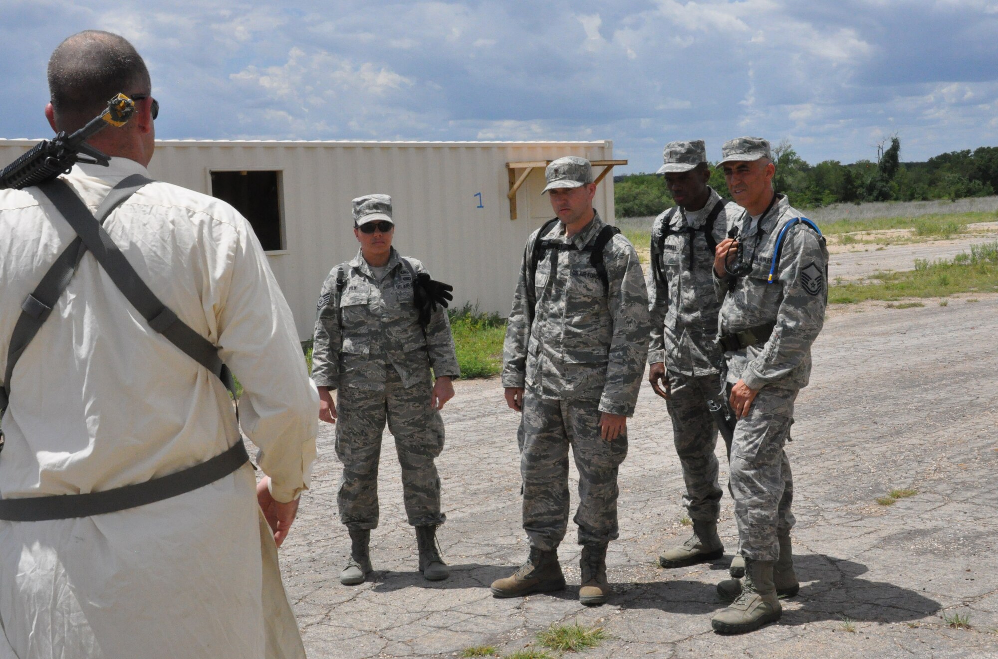 Chaplain candidates learn how to negotiate in a simulated deployed environment during a counterintelligence exercise Sunday, July 21 at Fort Wolters, Mineral Wells, Texas. The exercise was part of Patriot Defender, a time where candidates learn what deployed life can be like for chaplains by engaging in multiple class and hand-on training exercises. Patriot Defender is part of a five-week tour candidates embark on to see if they want to become chaplains. It is also a time when chaplain cadre can evaluate candidates and see if they would be a good fit for the program. (U.S. Air Force photo by Senior Airman Melissa Harvey)