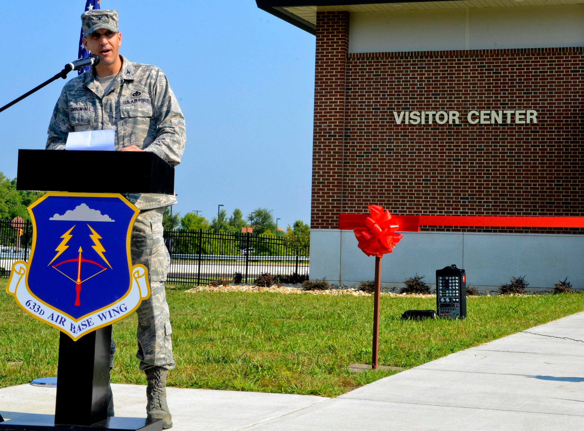 U.S. Air Force Col. David Chisenhall, 633rd Mission Support Group commander, speaks during a ribbon cutting ceremony at the newly-constructed LaSalle Avenue Gate at Langley Air Force Base, Va., July 19, 2013. The LaSalle Gate is fully operational and open 24 hours a day, while the Visitors’ Center is open Monday through Friday from 5 a.m. to 7 p.m., and Saturday and Sunday from 7:30 a.m. to 5 p.m. (U.S. Air Force photo by Airman 1st Class R. Alex Durbin/ Released)