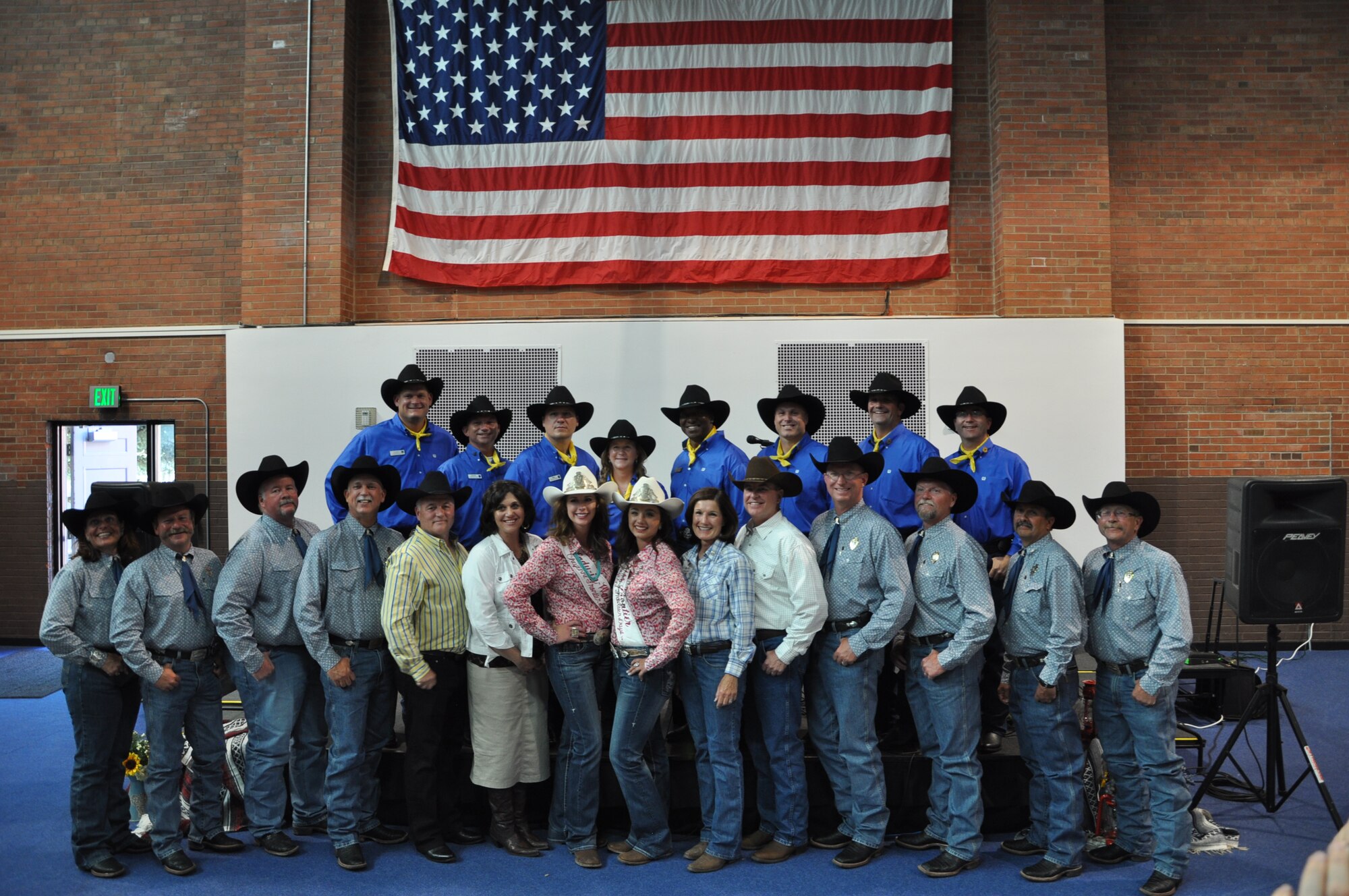 Air Force Chief of Staff Gen. Mark A. Welsh III; his wife, Betty; Maj. Gen. Michael Carey, 20th Air Force commander; and his wife, Melody, pose for a photograph with F.E. Warren Air Force Base, Wyo., leadership; Cheyenne Frontier Days committee members; and Chloe Pfoor, Miss Frontier; and Kaci Malmborg, her Lady-in-Waiting; July 20, 2013, in the Fall Hall Community Center before a reception dinner to honor General Welsh. Welsh, who served as grand marshal for the opening CFD parade, visited the region to participate in rodeo events, but also to thank Airmen and the community for the continued service and support. (U.S. Air Force photo by Senior Airman Mike Tryon)
