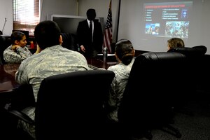 A U.S. Air Force Office of Special Investigations special agent conducts a travel briefing at Langley Air Force Base, Va., July 11, 2013. The travel briefing is mandatory for Service members and those with Department of Defense-issued security clearances who plan to travel outside of the U.S. (U.S. Air Force photo by Senior Airman Kayla Newman/Released)