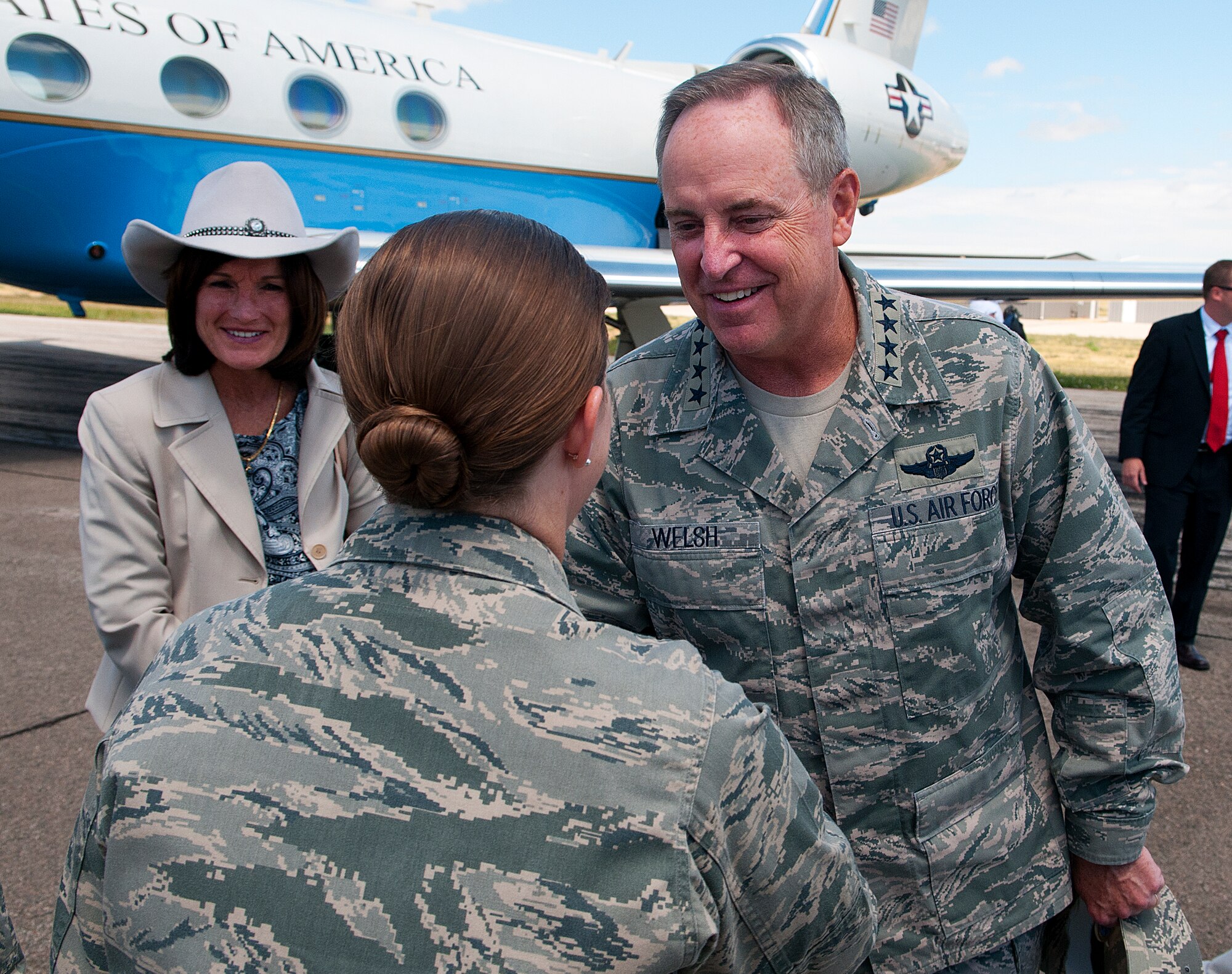 Col. Tracey Hayes, 90th Missile Wing commander, greets Air Force Chief of Staff Gen. Mark A. Welsh III and his wife, Betty, after they arrive at Cheyenne Regional Airport, Wyo., July 19, 2013. Welsh arrived to take part in Cheyenne Frontier Days and to thank Warren Airmen and community members for their continued service and support. (U.S. Air Force photo by R.J. Oriez)