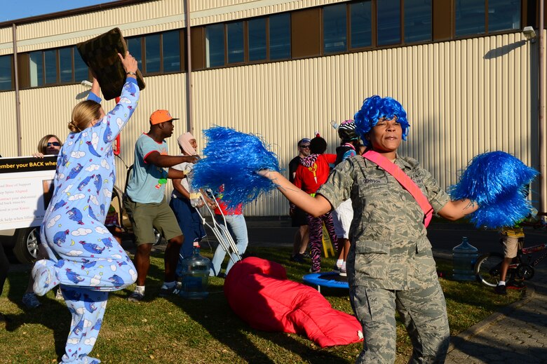 SPANGDAHLEM AIR BASE, Germany – U.S. Air Force Airmen cheer on their coworkers during a jody run July 19, 2013. The jody run event was put on by the First Four private military organization and the proceeds supported the Wounded Warrior Program and the Red Cross. (U.S. Air Force photo by Airman 1st Class Kyle Gese/Released)