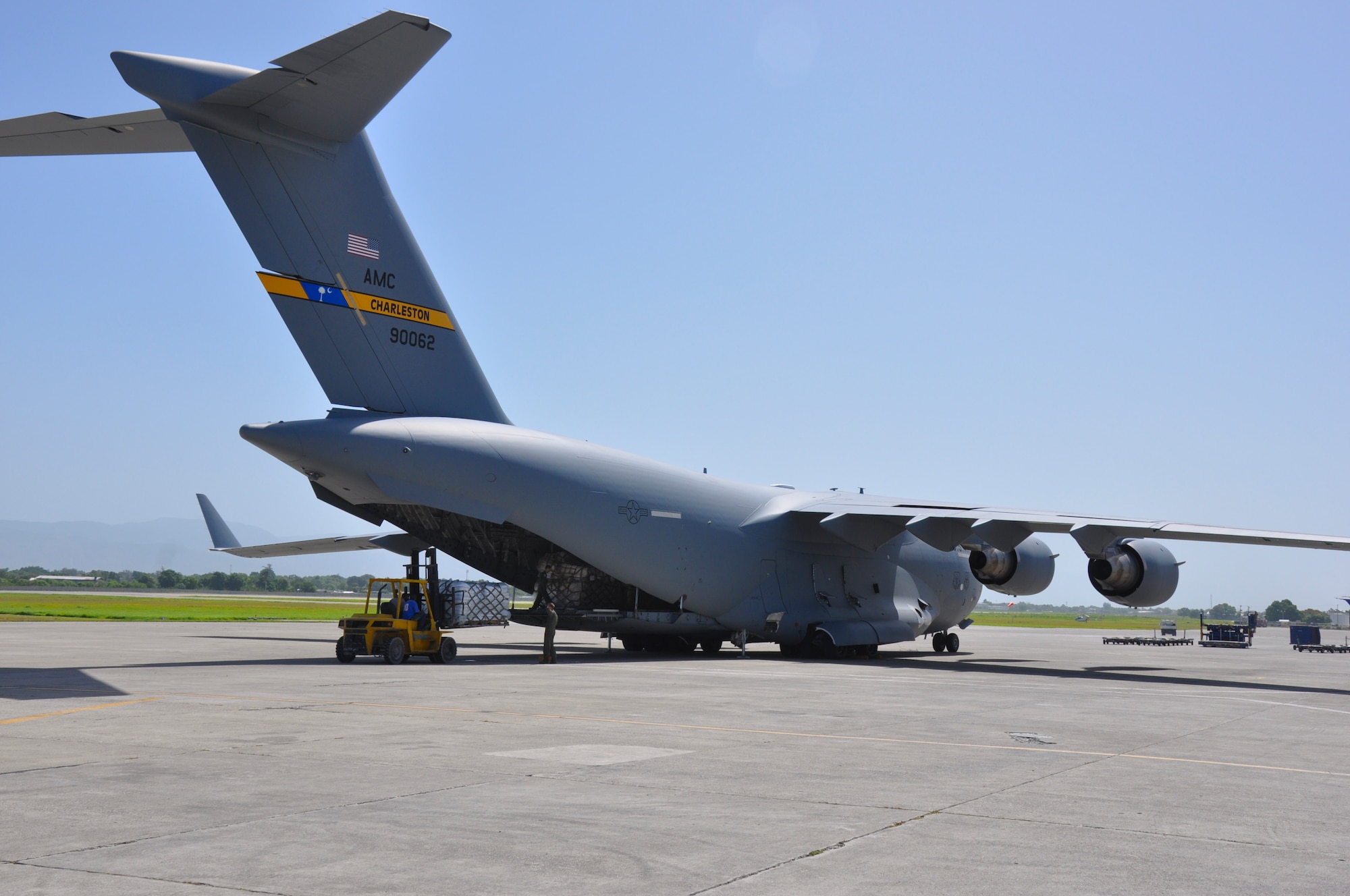 Members of the 315th Airlift Wing from Joint Base Charleston, S.C. delivered 86,200 pounds of humanitarian aid to El Salvador and Haiti on a training mission this weekend.  (U.S. Air Force photo by Maj. Wayne Capps)