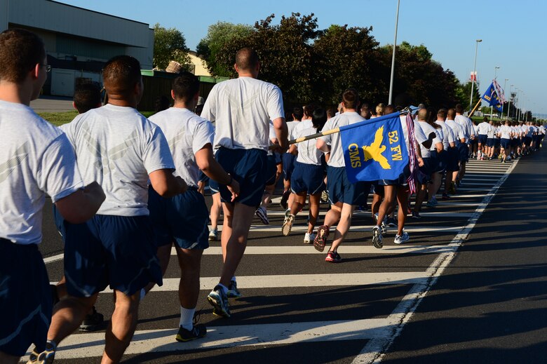 SPANGDAHLEM AIR BASE, Germany – U.S. Air Force Airmen call out cadences during a base-wide run July 19, 2013. The event was held to support the Wounded Warrior Program and Red Cross. The First Four private military organization also designed the run to foster team building and heighten morale. (U.S. Air Force photo by Airman 1st Class Kyle Gese/Released)