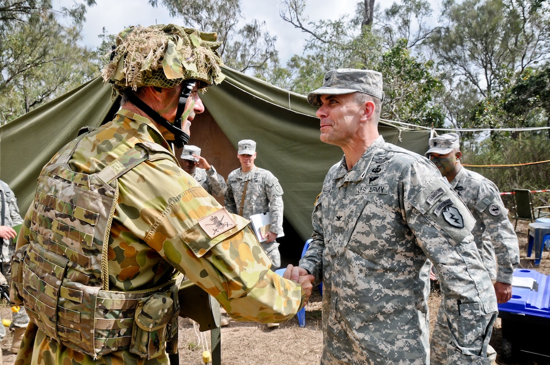 U.S. Army Col. Matthew McFarlane, right, meets with Australian army Brig. Gen. Shane Caughey at the Shoalwater Bay Training Area, Australia, July 21, 2013, as part of Talisman Saber 2013. MacFarland is the commander of the 25th Infantry Division's 4th Infantry Brigade Combat Team, and Caughty is the commander of the Australian army's 3rd Brigade.
