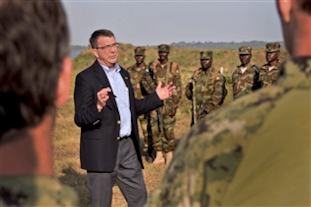 U.S. Deputy Defense Secretary Ash Carter meets with U.S. and Ugandan troops on Kisenyi Peacekeeping Base, Uganda, July 23, 2013. Carter met with government and military leaders to affirm the growing security partnership between the United States and Uganda.
