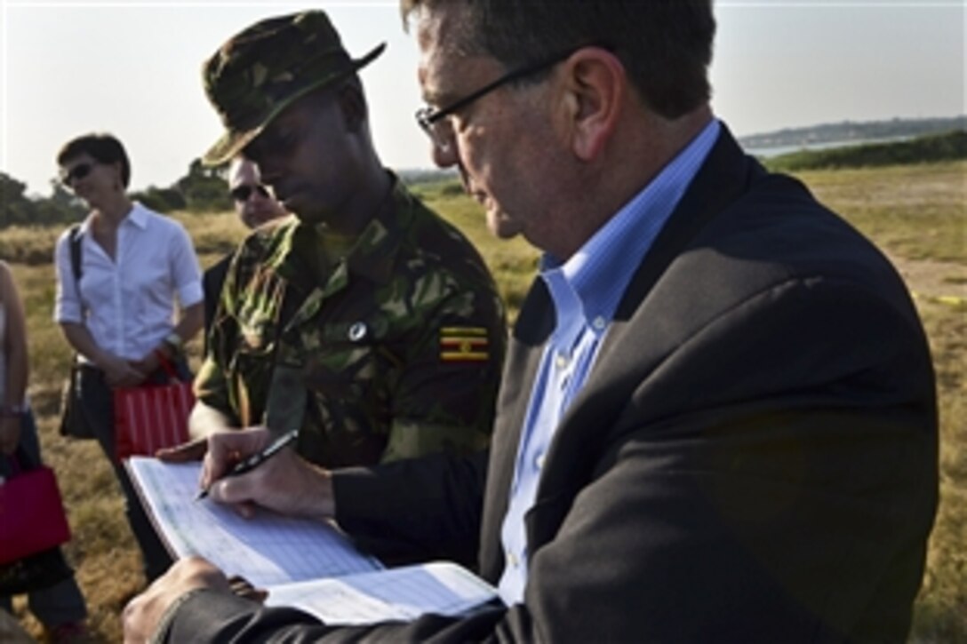 U.S. Deputy Defense Secretary Ash Carter meets with U.S. and Ugandan troops on Kisenyi Peacekeeping Base, Uganda, July 23, 2013. Carter met with government and military leaders to affirm the growing security partnership between the United States and Uganda.