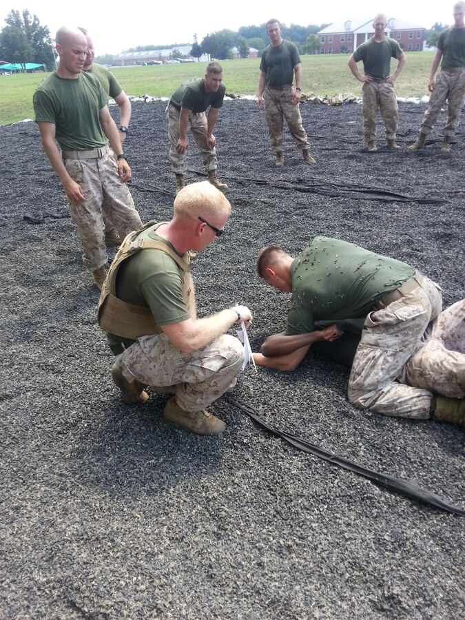 Sgt. Jack Latham, enlisted squad advisor for 5th Platoon of Charlie Company at The Basic School, guides lieutenants in Marine Corps Martial Arts Program training. Charlie Co. is the school’s first company to incorporate enlisted Marines from the Combat Instructor Company of the former Support Battalion into its companies of student lieutenants. 