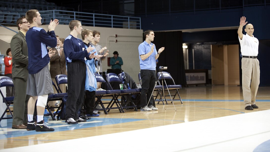 Brig. Gen Thomas Gorry, commanding general Marine Corps Installations East – Marine Corps Base Camp Lejeune stands to be recognized at the University of North Carolina at Chapel Hill during Military Appreciation Night at the school Feb. 8. Gorry was recently inducted into the wrestling hall of fame for overall achievements during his wrestling career at UNC. Gorry cheered during the match as his alumni went on to win an overall team victory against the Virginia Military Institute. 