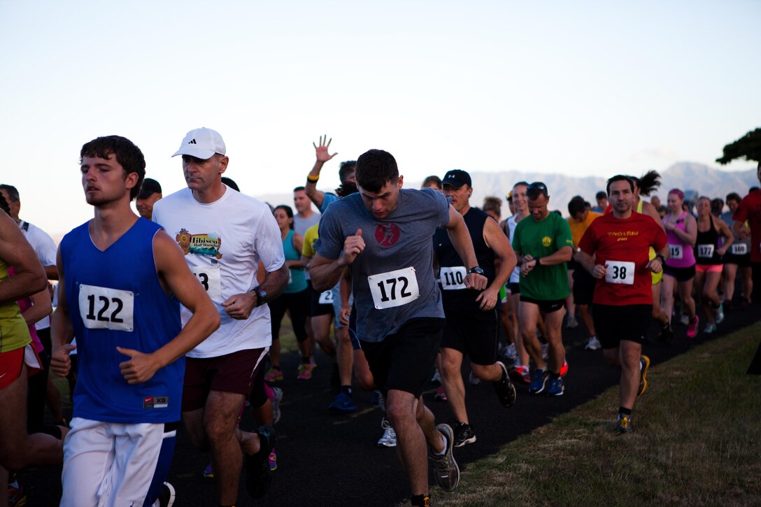 More than 150 service members, their families and other members of the community run in the Camp Smith 5K Grueler here July 20. The route, known for its scenic views and grueling ascent close 400 feet, also attracted many runners who were on Oahu for vacation. 