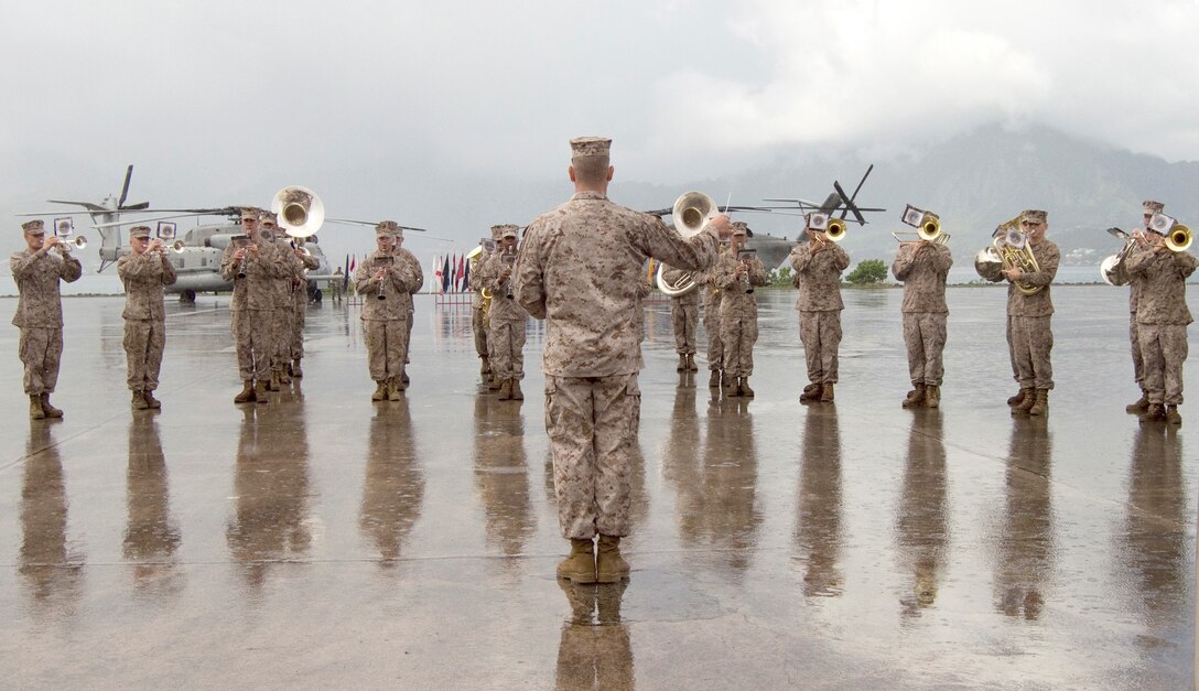 The U.S. Marine Corps Forces, Pacific Band performs during a change of command ceremony between Hangars 102 and 103, April 23, 2013. Lt. Col. Jeffrey Davis, outgoing commanding officer, Marine Heavy Helicopter Squadron 463, turned leadership of the squadron to Lt. Col. Richard Matyskiela, incoming commanding officer, HMH-463. (U.S. Marine Corps photo by Kristen Wong)