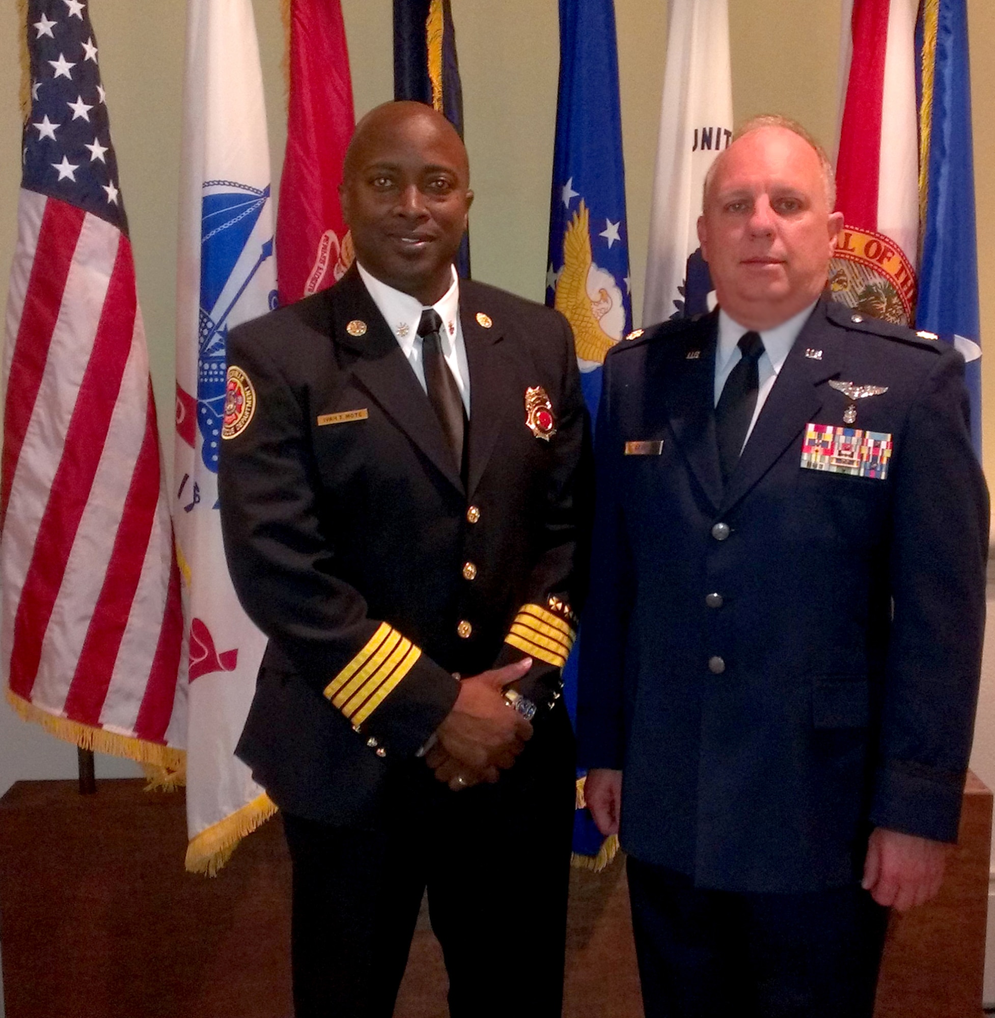 Maj. James Grant (right), 920th Aeromedical Staging Squadron nurse and Citizen Airman with the Jacksonville Fire and Rescue Department, poses with the division chief of rescue at the fire department, Chief Ivan Mote.  Grant nominated the department for a Patriot Award for their outstanding support of his military service. Subsequently, the department came out as one of the top three nominees for this coveted award in the state of Florida. (Courtesy photo)