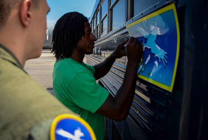 Andre Roberts, Arizona Cardinals wide receiver, signs his autograph July 16, 2013, at Joint Base Charleston – Air Base, S.C. Roberts was visiting Charleston to host the Andre Roberts ProCamp July 15 and16 at the JB Charleston – Weapons Station, S.C. More than 100 base children attended the camp and participated in fundamental football drills. Small groups ensured each camper received maximum instruction from the area’s top football coaches. Roberts funded the camp, enabling children to attend for free.  (U.S. Air Force photo/ Senior Airman Jared Trimarchi)