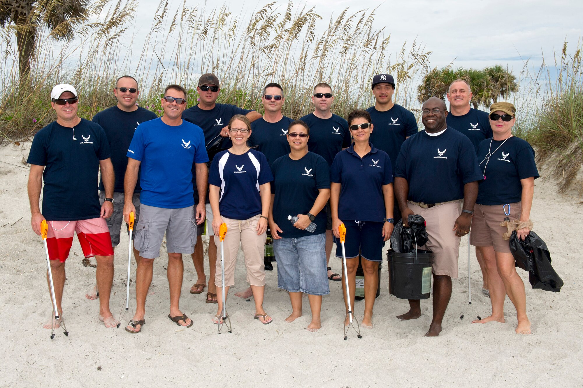 Members of the 333rd Recruiting Squadron pose for a photo during a quarterly beach cleanup in support of ‘Keeping Brevard Beautiful’ near the Beach House at Patrick Air Force Base, Fla., The Beach House is open Tuesday through Sunday from 10 a.m. to 8 p.m. (U.S. Air Force photos/Cory Long) (Released)