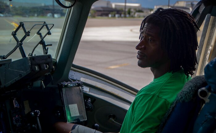Andre Roberts, wide receiver for the NFL’s  Arizona Cardinals, sits in the flight deck of a C-17 Globemaster III July 16, 2013, at Joint Base Charleston – Air Base. Roberts was visiting Charleston to host the Andre Roberts Pro Camp July 15 and16 at the JB Charleston – Weapons Station, S.C. More than 100 base children attended the camp and participated in fundamental football drills. Small groups ensured each camper received maximum instruction from the area’s top football coaches. Roberts funded the camp, enabling children to attend for free.  (U.S. Air Force photo/ Senior Airman Jared Trimarchi)
