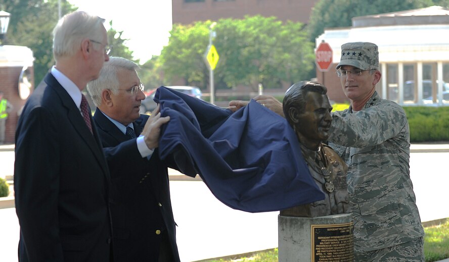 The Airlift Tanker Association inducted Medal of Honor recipient Staff Sgt. William H. Pitsenbarger into the ATA Walk of Fame with the unveiling of his bust July 18, 2013 at Scott Air Force Base, Ill.  More than 50 members of the ATA showed up for the Walk of Fame induction ceremony which gathered outside of the 375th Air Mobility Wing building. (U.S. Air Force photo/Senior Airman Divine Cox)
