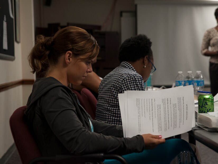 Capt. Audrey McCabe, 15th Airlift Squadron pilot, reviews paperwork during a Sexual Assault Prevention and Response class. McCabe attended the class along with 13 other soon-to-be Victim Advocates July 24, 2013, at Joint Base Charleston – Air Base, S.C. SARCs and VAs are available at major Department of Defense installations to assist victims of sexual assault. The JB Charleston SARC can be reached at 843-963-7272 and DOD has a 24-hour hotline at 1-800-342-9647. (U.S. Air Force photo/Senior Airman Ashlee Galloway)1-800-342-9647. (U.S. Air Force photo/Senior Airman Ashlee Galloway)