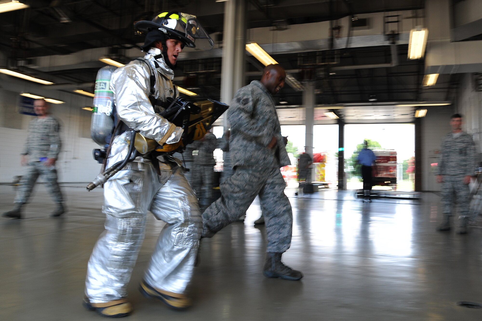 U.S. Air Force Chief Master Sgt. Richard Parsons, command chief of Air Combat Command, finishes the firefighters’ challenge at the 633rd Civil Engineer Squadron fire station on Langley Air Force Base, Va., July 17, 2013. Firefighters at the 633rd CES must finish the physical assessment in less than eight minutes in order to pass. (U.S. Air Force photo by Airman 1st Class Victoria H. Taylor/Released)