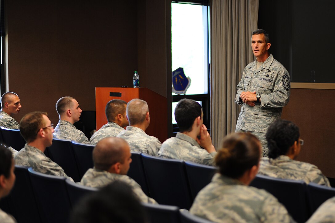 U.S. Air Force Chief Master Sgt. Richard Parsons, command chief of Air Combat Command, speaks at the informed decision briefing at Langley Air Force Base, Va., July 17, 2013. During the briefing, Parsons spoke about civilian jobs, staying in the Air Force for the right reasons and thanked everyone for their service. (U.S. Air Force photo by Airman 1st Class Victoria H. Taylor/Released)