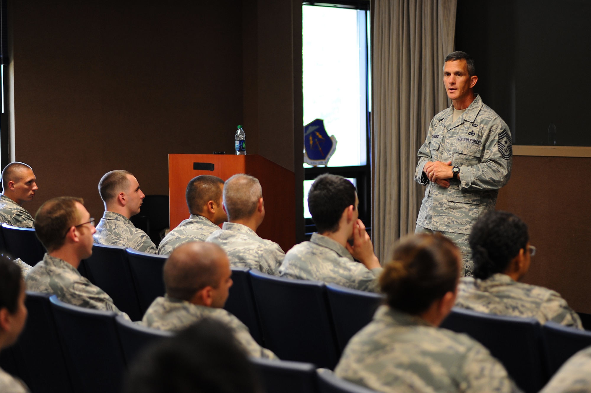 U.S. Air Force Chief Master Sgt. Richard Parsons, command chief of Air Combat Command, speaks at the informed decision briefing at Langley Air Force Base, Va., July 17, 2013. During the briefing, Parsons spoke about civilian jobs, staying in the Air Force for the right reasons and thanked everyone for their service. (U.S. Air Force photo by Airman 1st Class Victoria H. Taylor/Released)