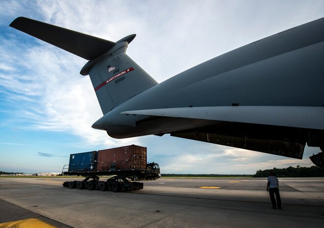 Airmen from the 437th Aerial Port Squadron load cargo into a West Virginia Air National Guard C-5 Galaxy from Martinsburg, W. Va., July 22, 2013 at Joint Base Charleston – Air Base, S.C. The cargo is being used to assist operation Enduring Freedom. The C-5 is one of the largest aircraft in the world and the largest airlifter in the Air Force inventory. (U.S. Air Force photo/ Senior Airman Dennis Sloan)