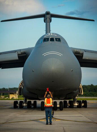 A West Virginia Air National Guard C-5 Galaxy from Martinsburg, W. Va., is marshaled into place July 22, 2013, at Joint Base Charleston, S.C. The C-5 crew loaded cargo to assist with operation Enduring Freedom. The C-5 is one of the largest aircraft in the world and the largest airlifter in the Air Force inventory. (U.S. Air Force photo/ Senior Airman Dennis Sloan)