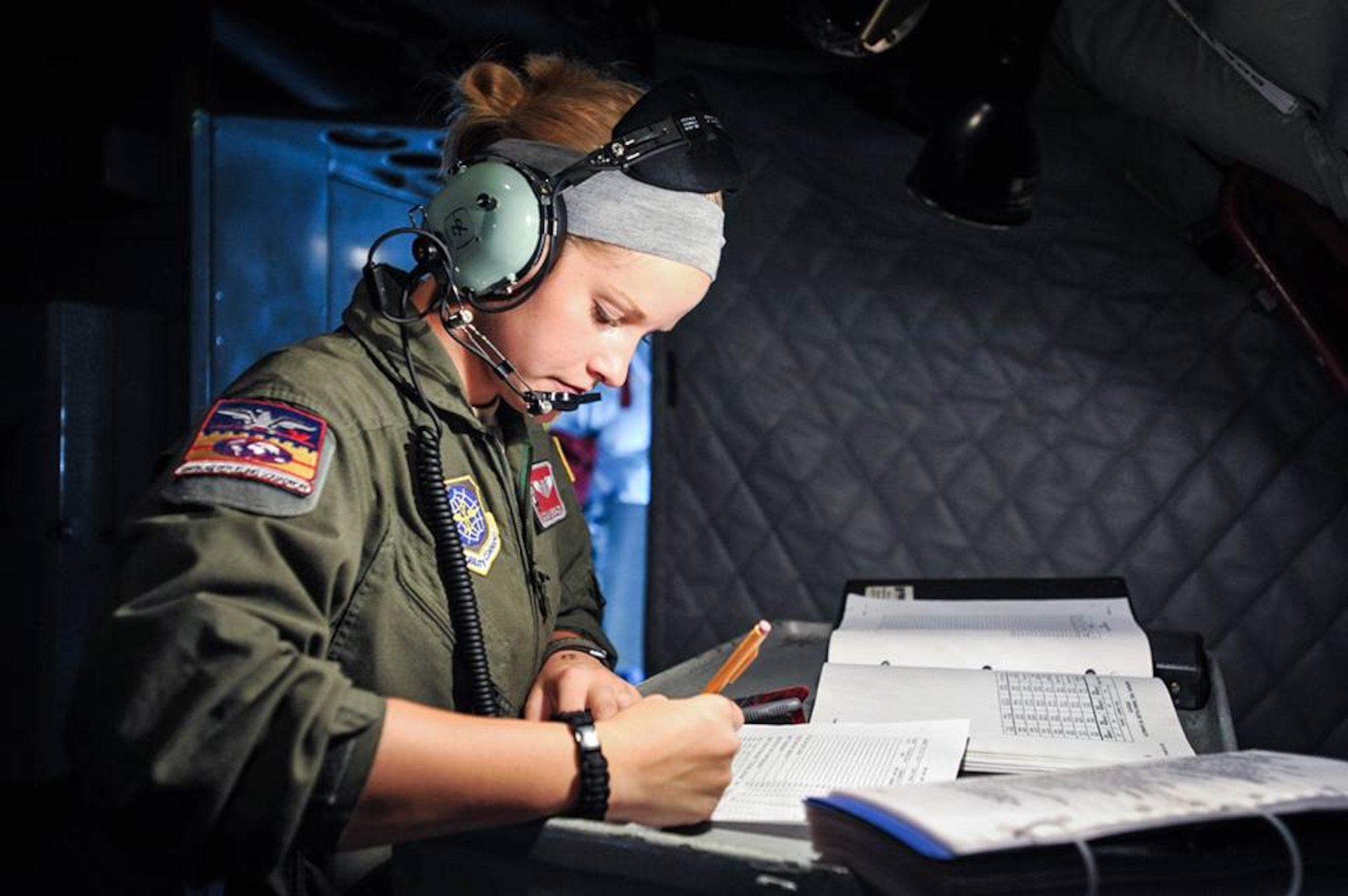 Airman 1st Class Autumn Hedrick-Cox, 384th Air Refueling Squadron boom operator, computes the weight and balance of a KC-135 Stratotanker to meet compliance with Air Force standards prior to a refueling mission at McConnell Air Force Base, Kan., July 23, 2013. Hendrick-Cox refueled two F-15 Eagles from the 142nd Fighter Wing, Oregon Air National Guard during a three-ship tanker sortie over northeast Kansas. (U.S. Air Force photo/ Staff Sgt. Jess Lockoski) 