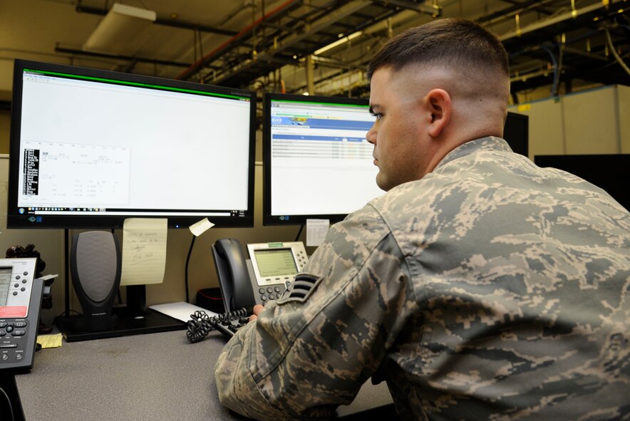 Senior Airman Jared Cooke, 2nd Communications Squadron cyber transport systems technician, checks work orders on Barksdale Air Force Base, La., July 23, 2013. The 2 CS uses a program called the Work Order Management System to organize and prioritize jobs. (U.S. Air Force photo/Airman 1st Class Andrew Moua)