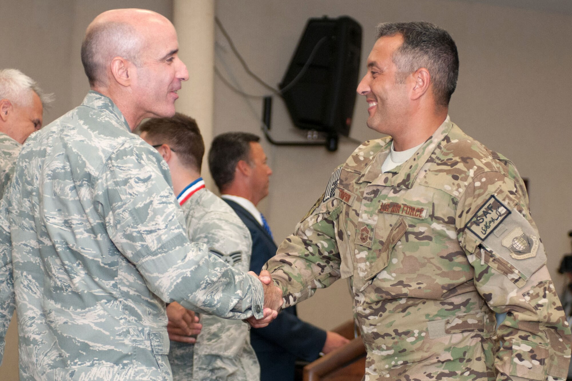 HANSCOM AIR FORCE BASE, Mass. – Chief Master Sgt. Joseph Thompson is welcomed home by Col. Lester A. Weilacher, 66th Air Base Group commander, during a Heroes Homecoming July 23. Thompson, along with more than 50 other Hanscom personnel, was welcomed home from deployment during the ceremony. (U.S. Air Force photo by Rick Berry)