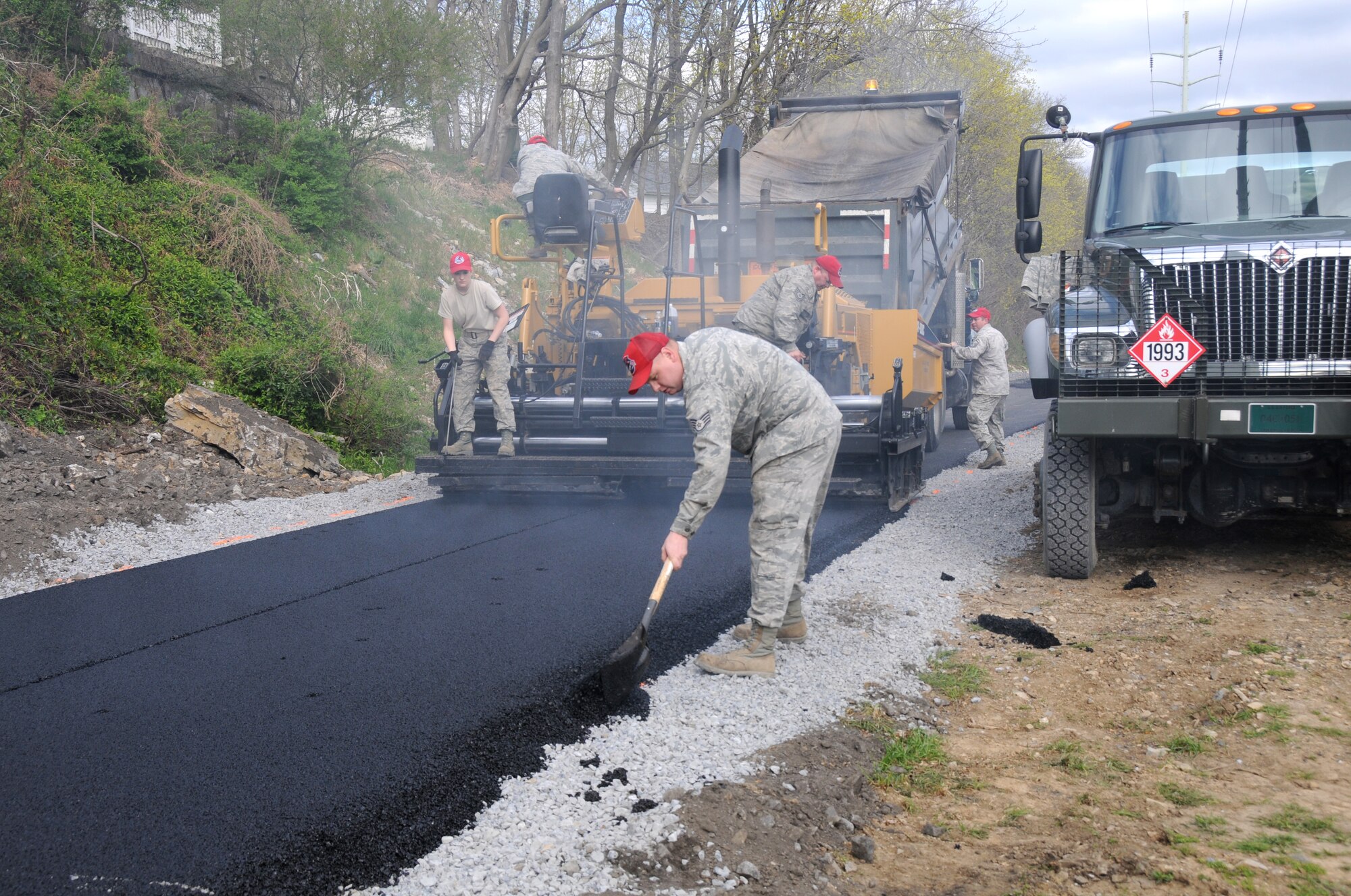 Members of the 201st RED HORSE pave a portion of the Lebanon Valley Rail Trail near 9th and Chestnut streets. (U.S. Air National Guard photo by Senior Master Sgt. David Hawkins/Released)