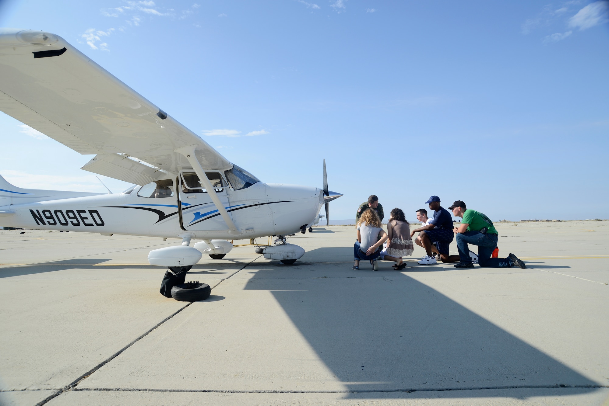 Lt. Col. Fred Bivetto, an instructor at the U.S. Air ForceTest Pilot School, explains how to perform a thorough pre-flight check to ensure a safe flight.  (U.S. Air Force photo by Rebecca Amber) 