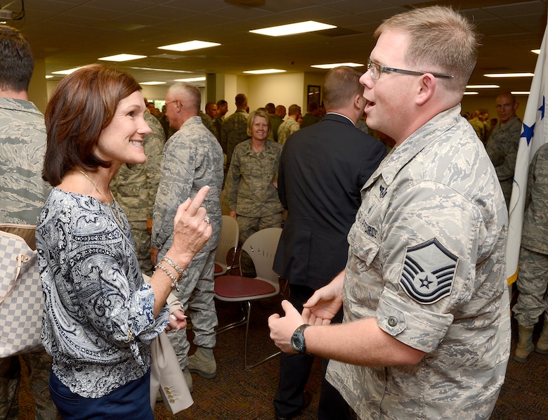 Betty Welsh, wife of Air Force Chief of Staff Gen. Mark A. Welsh III, speaks with Master Sgt. Michael Hensala, 153rd Maintenance Squadron, after an Airmen's call July 19, 2013 in Cheyenne, Wyo. The 153rd Airlift Wing hosts the Air National Guard's first active duty associate unit, the 30th Airlift Squadron.  As part of a multi-day visit to the area, the chief and Mrs. Welsh also met with commanders and spouses of the wing to thank them for their service and support and address key issues affecting the Air Force. (U.S. Air Force photo/Scott Ash)