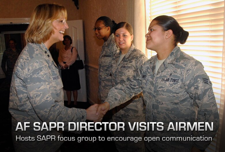 Maj. Gen. Margaret Woodward, left, greets Senior Airman Jhosselin Alonzo during a focus group session at Wright-Patterson Air Force Base, Ohio, July 23, 2013. Woodward and her team are undergoing a series of visits at several bases, to gather information and hear from Airman in the field about sexual assault prevention and reporting. During her visit, she met with several groups, to include officers, enlisted and DOD civilians. Woodward is the Air Force Sexual Assault Prevention and Response Office director and Alonzo heads up Wright-Patt's Air Force Junior Support, a group founded on helping their peers cope with the many challenges young Airmen face. (U.S. Air Force photo/Albert Bright)