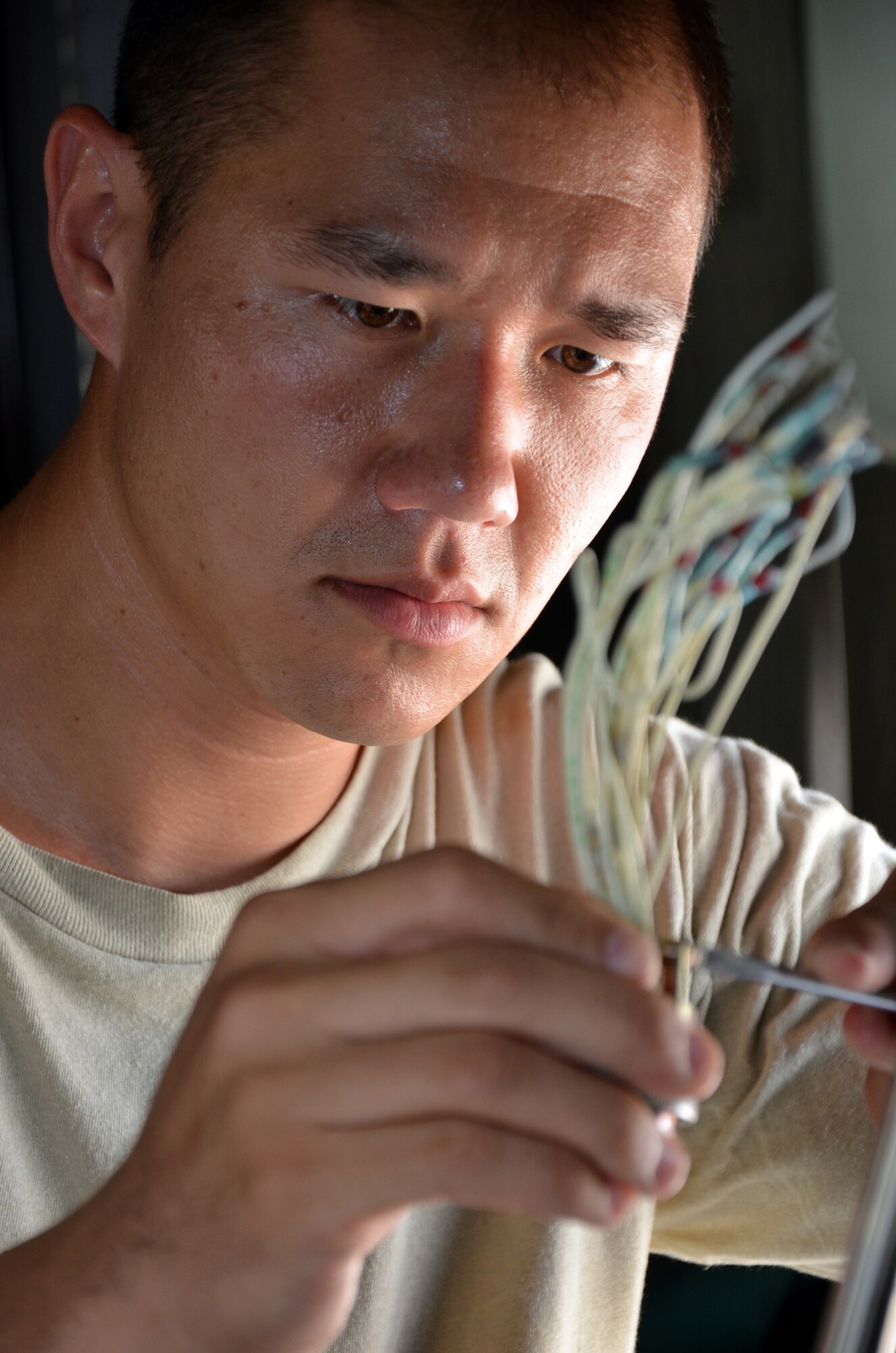 Staff Sgt. Joey Taylor, 920th Maintenance Group, works inside an HC-130 King aircraft on the flight line at Patrick Air Force Base, Fla., July 24, 2013. Taylor and fellow maintenance Airmen in the group use an innovative tracking system for all training including pre-deployment. (U.S. Air Force photo/Tech. Sgt. Anna-Marie Wyant)