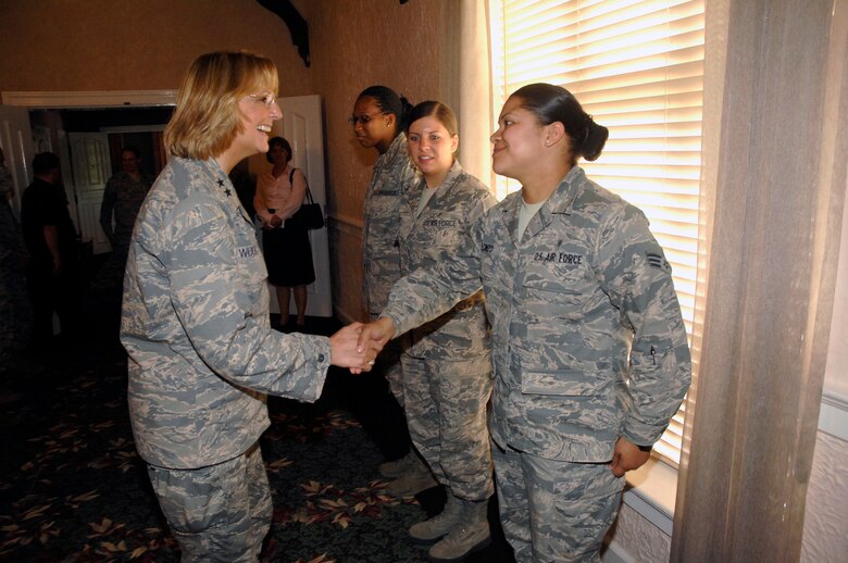 Maj. Gen. Margaret Woodward, left, greets Senior Airman Jhosselin Alonzo during a focus group session at Wright-Patterson Air Force Base, Ohio, July 23, 2013. Woodward and her team are undergoing a series of visits at several bases, to gather information and hear from Airman in the field about sexual assault prevention and reporting. During her visit, she met with several groups, to include officers, enlisted and DOD civilians. Woodward is the Air Force Sexual Assault Prevention and Response Office director  and Alonzo heads up Wright-Patt's Air Force Junior Support, a group founded on helping their peers cope with the many challenges young
Airmen face.  (U.S. Air Force photo/Albert Bright)