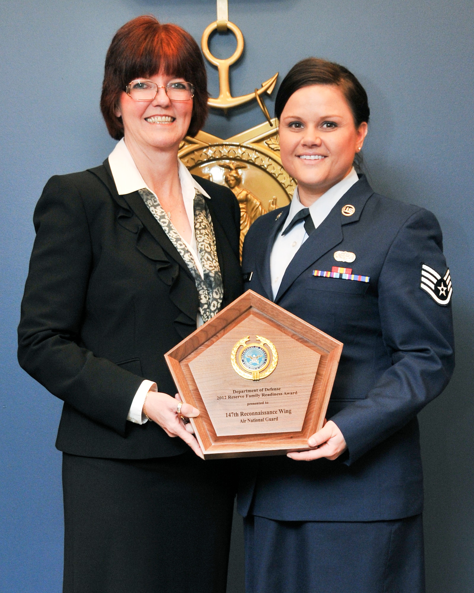 Ms. Monalisa Norton, 147th Reconnaissance Wing Airman and Family Readiness Program Manager, and Staff Sgt. Holly Yeagley, assistant to Ms. Norton, were presented with a plaque during the Department of Defense Reserve Family Readiness Awards ceremony at the Pentagon March 1, 2013. Ms. Norton and the 147th RW Family Readiness office were named as the best in the Air National Guard for 2012. (National Guard photo by Master Sgt. Sean Cowher)
