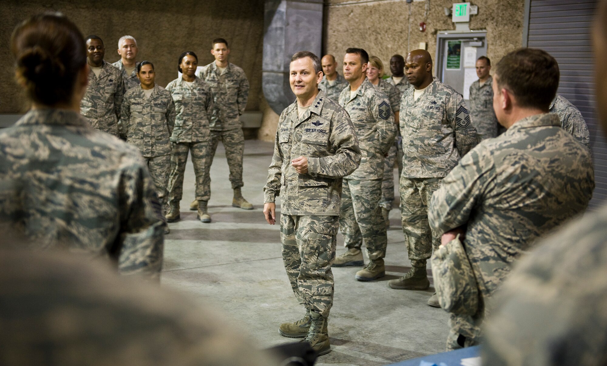 Lt. Gen. John W. Hesterman III talks with Airmen from the 379th Expeditionary Maintenance Squadron during his visit with units from across the wing at the 379th Air Expeditionary Wing in Southwest Asia, July 23, 2013. Hesterman is the Combined Force Air Component Commander responsible for developing contingency plans and conducting air operations in a 20-nation area of responsibility covering Central and Southwest Asia. (U.S. Air Force photo/Senior Airman Benjamin Stratton)
