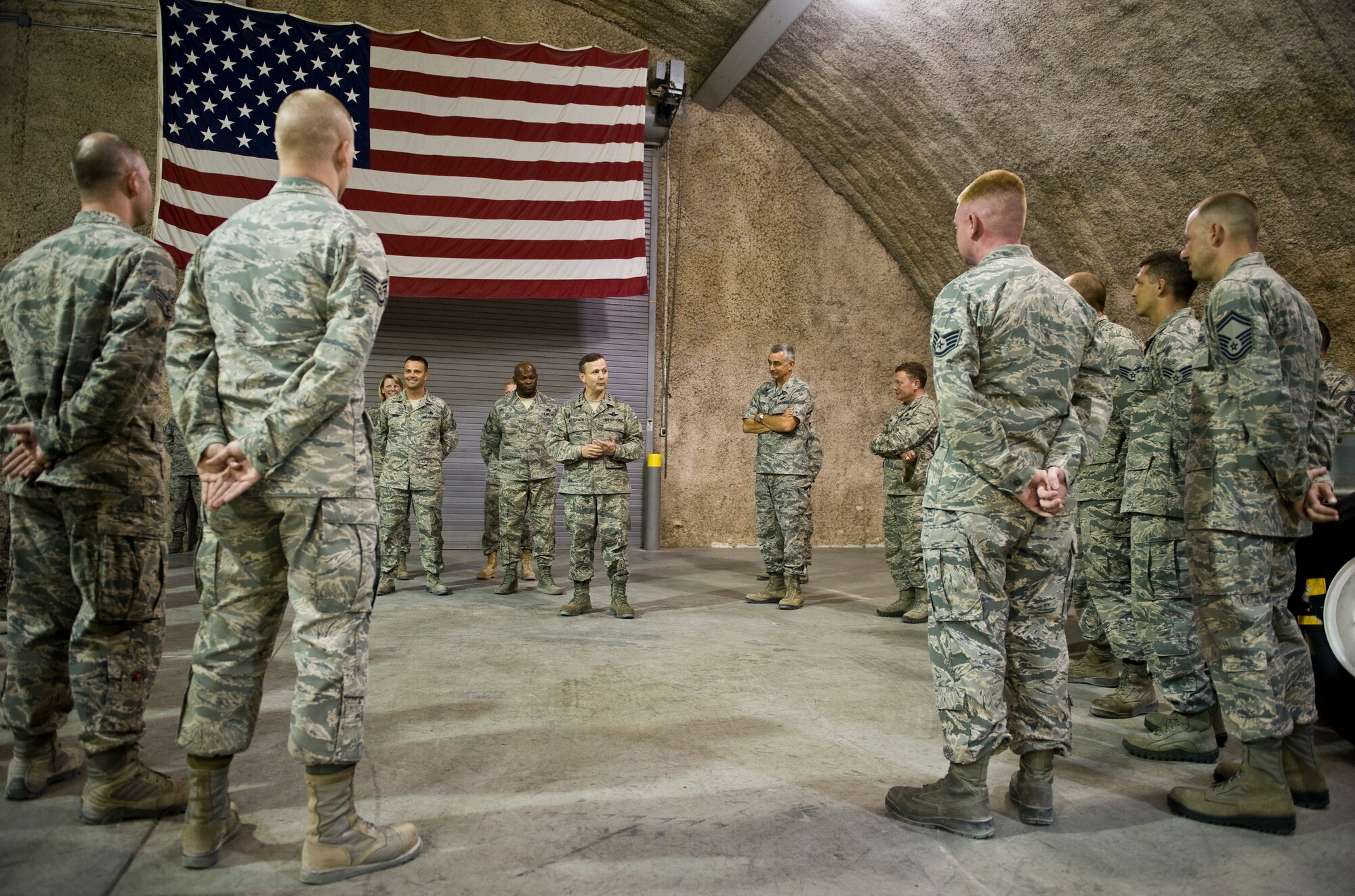 Lt. Gen. John W. Hesterman III talks with Airmen from the 379th Expeditionary Maintenance Squadron during his visit with units from across the wing at the 379th Air Expeditionary Wing in Southwest Asia, July 23, 2013. Hesterman is the Combined Force Air Component Commander responsible for developing contingency plans and conducting air operations in a 20-nation area of responsibility covering Central and Southwest Asia. (U.S. Air Force photo/Senior Airman Benjamin Stratton)