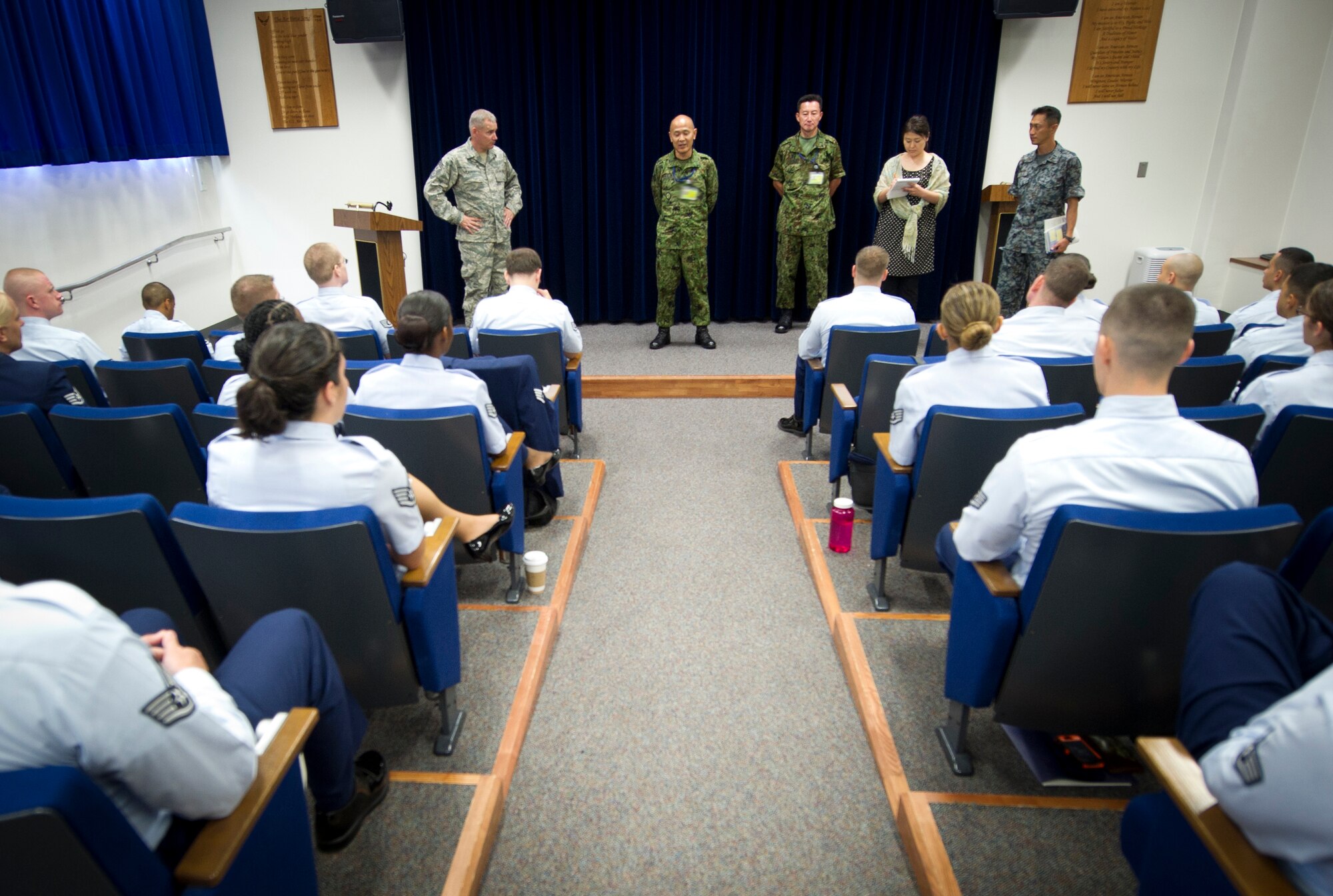 YOKOTA AIR BASE, Japan -- Japan Ground Self-Defense Force Warrant Officer Yoshihiro Obata, Japan Joint Staff Office senior enlisted advisor; and United States Forces, Japan and 5th Air Force Command Chief Master Sgt. James Laurent, speak before a conflict management briefing July 22, 2013, at Yokota Air Base, Japan. Obata toured Yokota's Professional Development Center to observe how Yokota develops their enlisted Airmen. (U.S. Air Force photo by Staff Sgt. Stacy Moless)