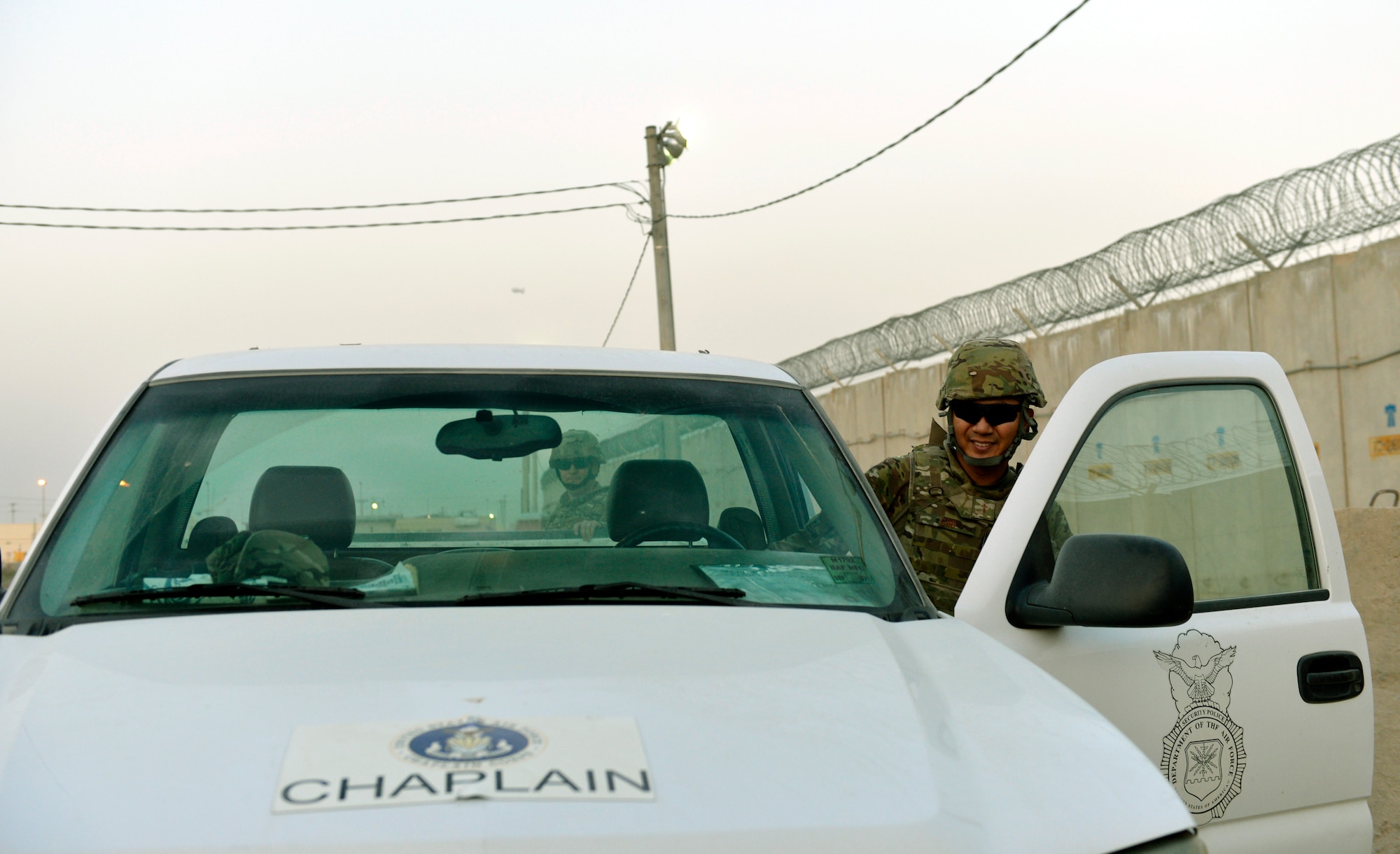 Caplain (Capt.) Myung Cho and his assistant get into their truck to go visit airmen assigned to the 455th Expeditionary Security Forces Group at Bagram Air Field, Afghanistan, July 17. Cho is a chaplain he visits the Airmen as much as he can to raise their morale and offer a variety of worship services. ( U.S. Air Force photo/ Staff Sgt. Stephenie Wade)
