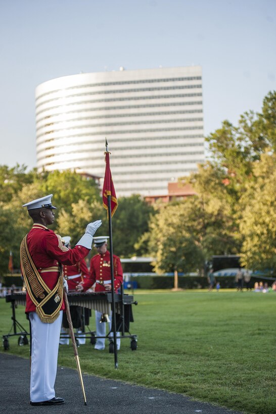 Master Gunnery Sgt. Kevin Buckles, U.S. Marine Drum & Bugle Corps drum major, performs during a Tuesday Sunset Parade at the Marine Corps War Memorial in Arlington, Va., July 23.