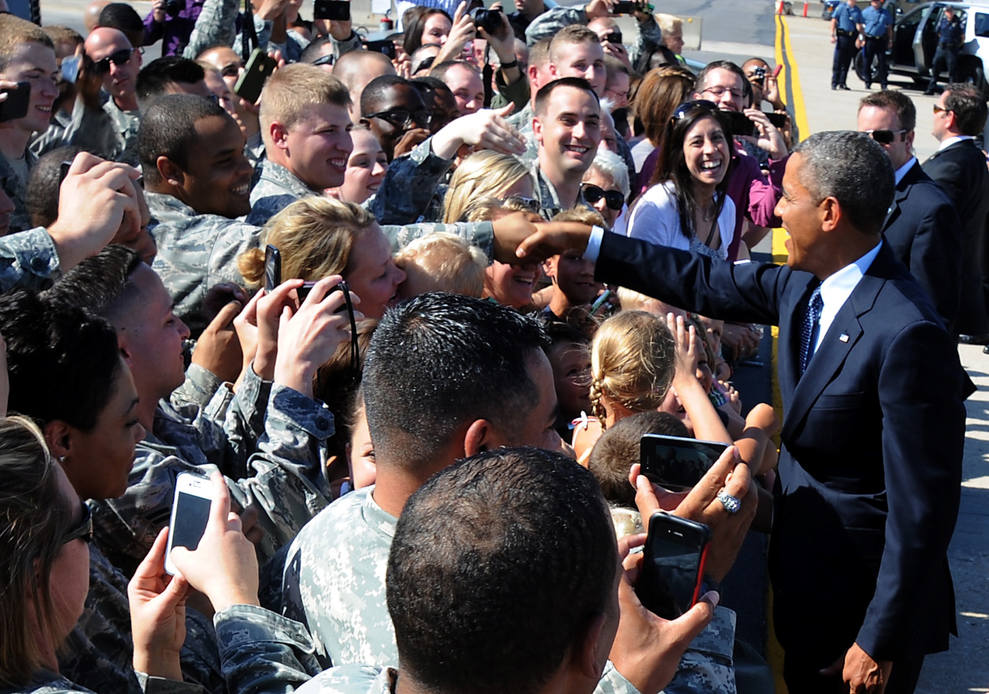 President Barack Obama shakes an Airman’s hand after landing at Whiteman Air Force Base, Mo., July 24, 2013. The president landed at Whiteman en route to Warrensburg, Mo., for an official speech. (U.S. Air Force photo Airman 1st Class Bryan Crane/Released)