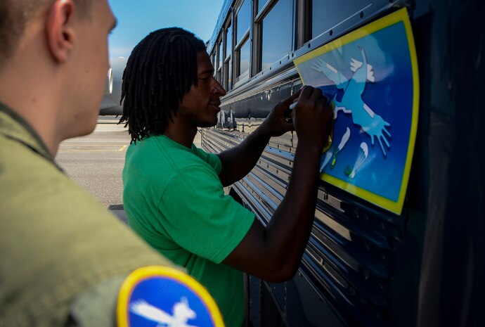 Andre Roberts, Arizona Cardinals wide receiver, signs his autograph July 16, 2013, at Joint Base Charleston – Air Base, S.C. Roberts was visiting Charleston to host the Andre Roberts ProCamp July 15 and16 at the JB Charleston – Weapons Station, S.C. More than 100 base children attended the camp and participated in fundamental football drills. Small groups ensured each camper received maximum instruction from the area’s top football coaches. Roberts funded the camp, enabling children to attend for free.  (U.S. Air Force photo/ Senior Airman Jared Trimarchi)