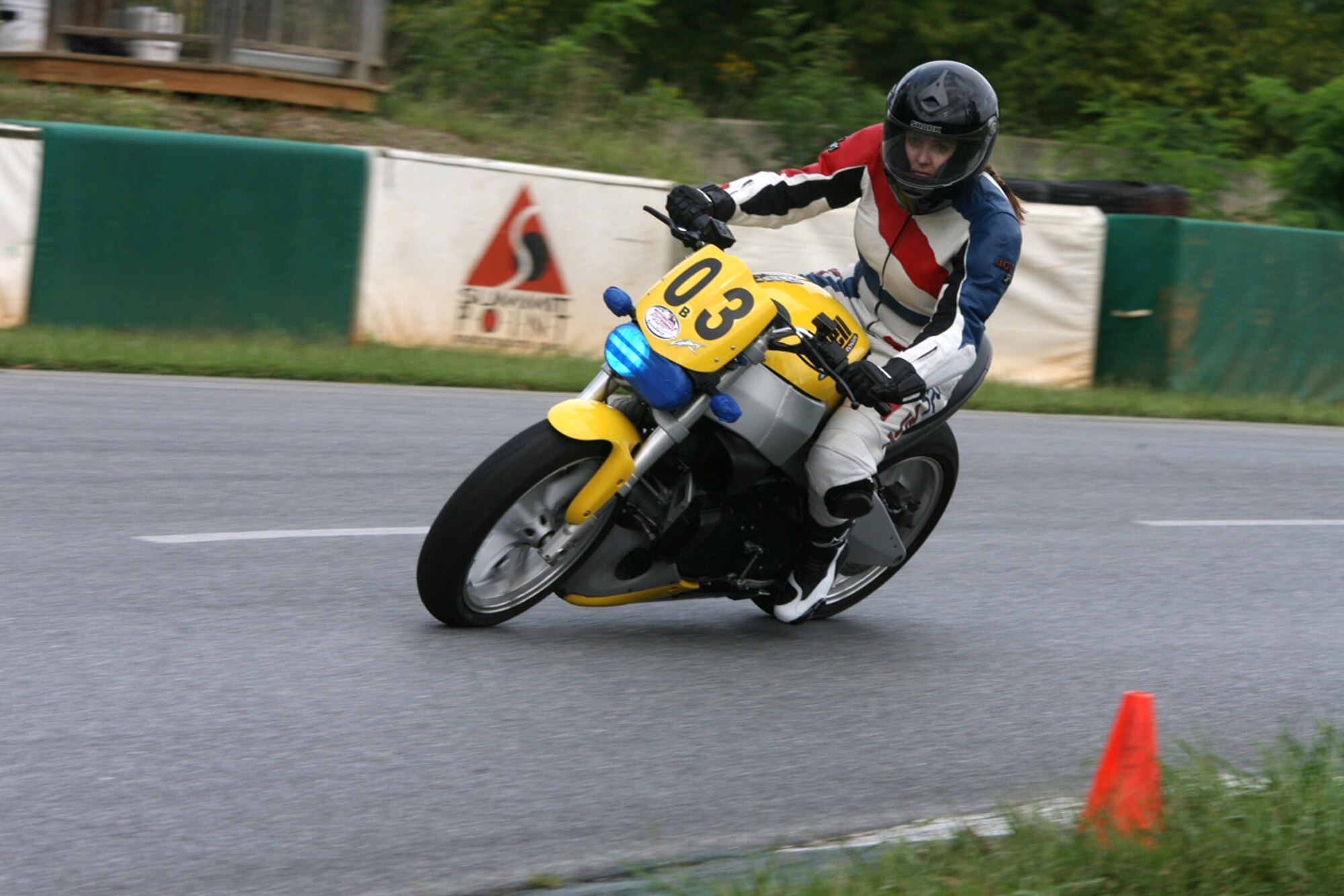 SUMMIT POINT, W. Va. – Senior Master Sgt. Marcy Broadway takes a turn at a motorcycle track in West Virginia September 2012 with her Buell 998cc Lightning streetfighter. (Courtesy photo/Released)